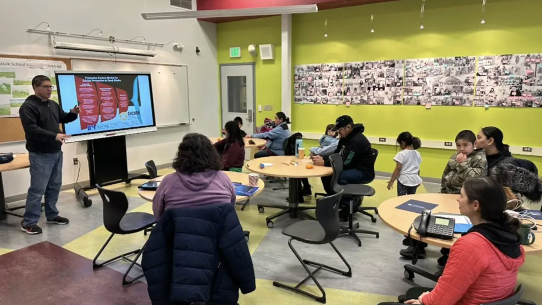 Classroom photo with an ANCHRS presentation running in Alaska